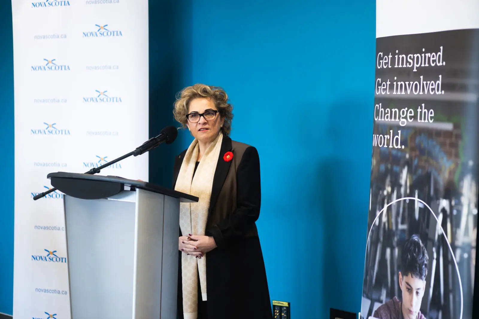 Image of Lena Metlege Diab, Nova Scotia’s minister of labour and advanced education, speaking at a podium in a government conference room